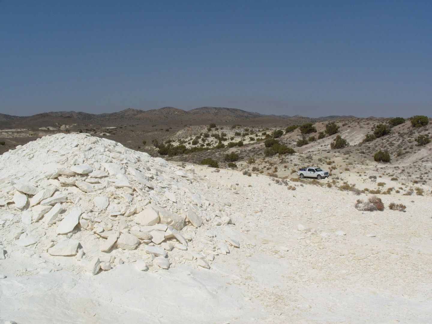 Extensive outcrops of diatomite forming current flat land surface and valley floor